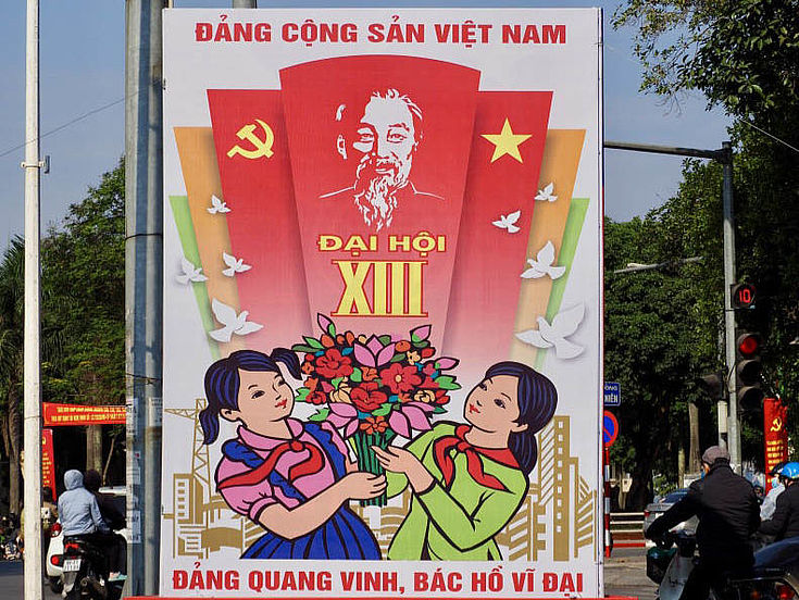 Propaganda posters such as the one in Ba Dinh, Hanoi, praise the Communist Party of Vietnam.