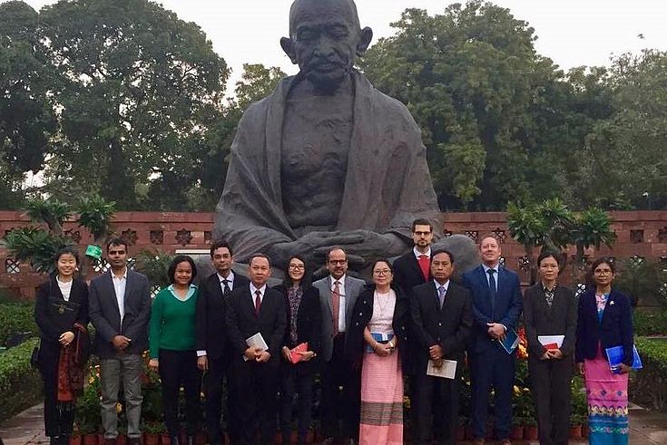 The delegation in front of a Mahatma Gandhi monument