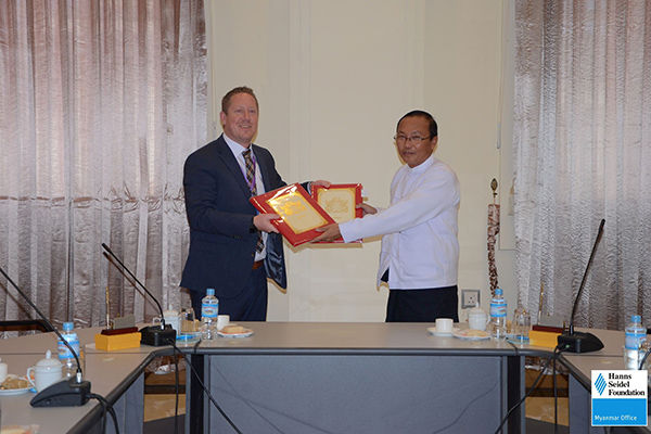 Hanns Seidel Foundation Myanmar Resident Representative Achim Munz and Director General of Amyotha Hluttaw U Lwin Oo with the signed MoU.