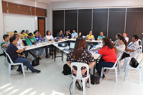 CBD workshop participants discussing in a U-shape table