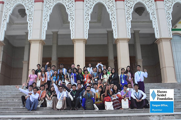 Participants of MFLP in front of the Hluttaw building on the stairs of the entrance.