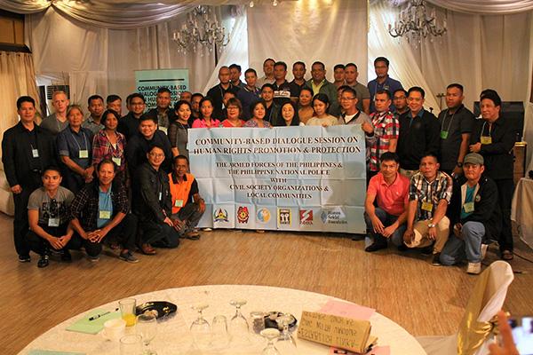 Group photo of the participants holding the banner