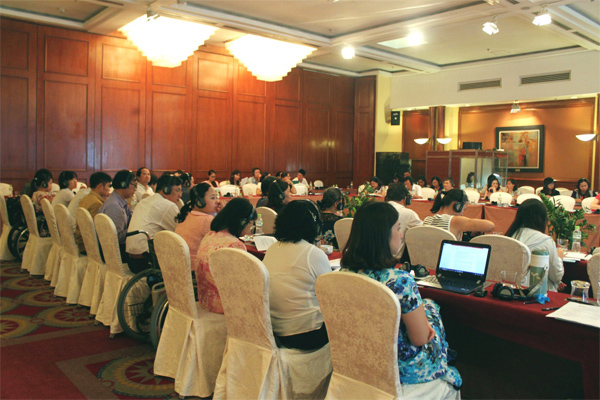 Delegates listen thoughtfully during a presentation